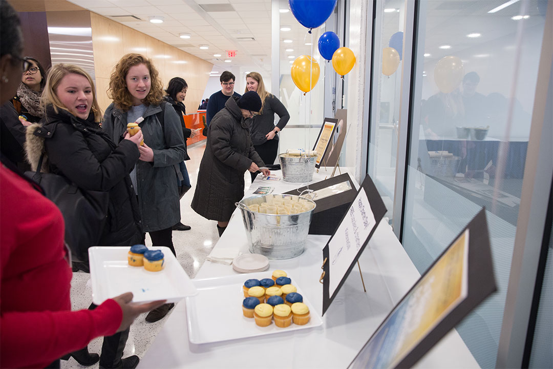 Students eating cupcakes on charter day